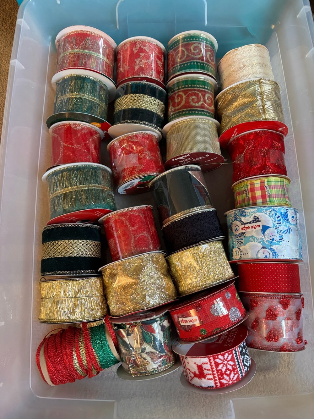 Huge lot of assorted Christmas ribbon. Most are brand new!